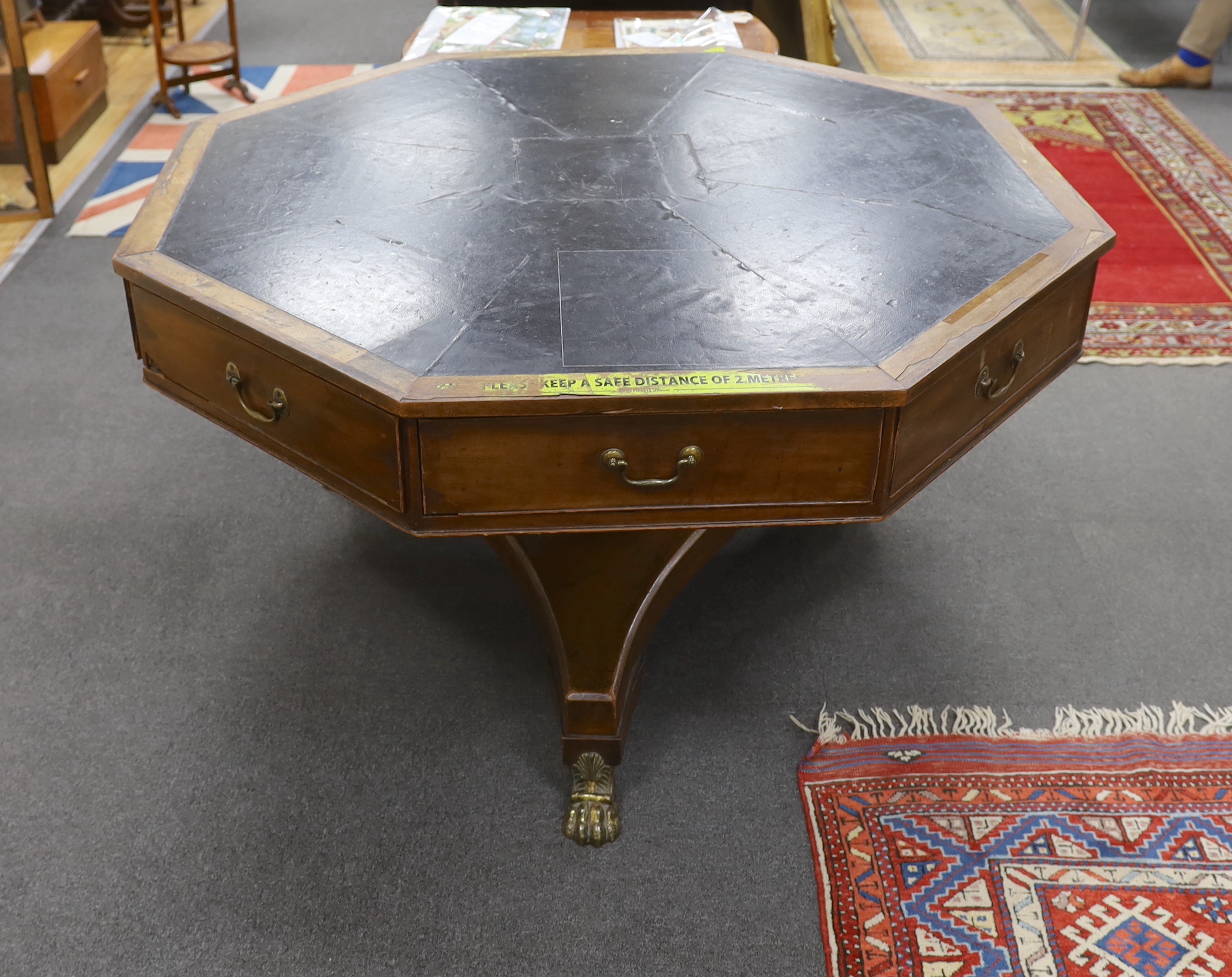 A George IV octagonal mahogany drum library table, width 130cm, height 77cm